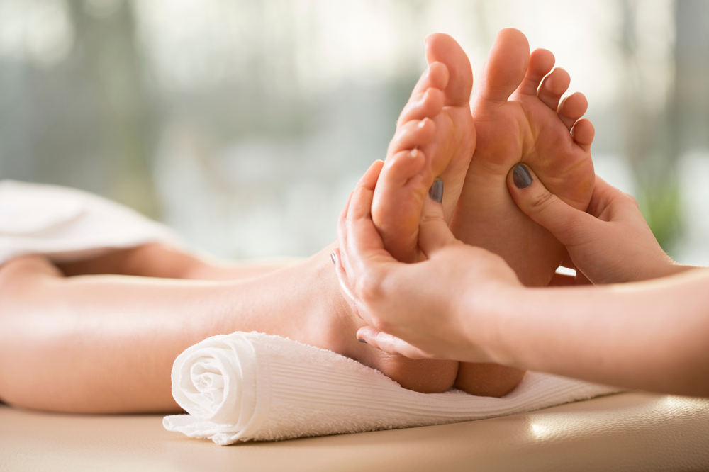Women feet massaging