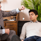 Man Being Hypnotized By A Hypnotherapist