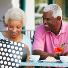 Elderly Couple Taking A Shopping Break