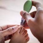 Mom Cutting A Baby&#039;s Toenails