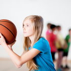Young Girl Playing Basketball