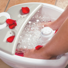 Woman Using An At-Home Massage Device