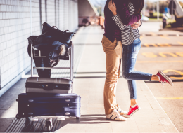 Couple Kissing At the Airport