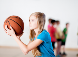 Young Girl Playing Basketball