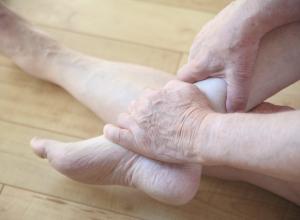 Person Experiencing Foot Pain