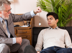 Man Being Hypnotized By A Hypnotherapist