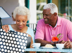 Elderly Couple Taking A Shopping Break