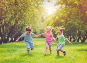 Children Running In the Grass
