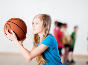 Young Girl Playing Basketball