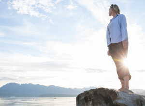 Tenderfoot Woman Barefoot on a Cliff