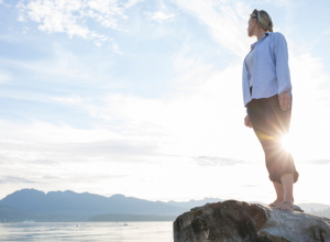 Woman Barefoot on a Cliff