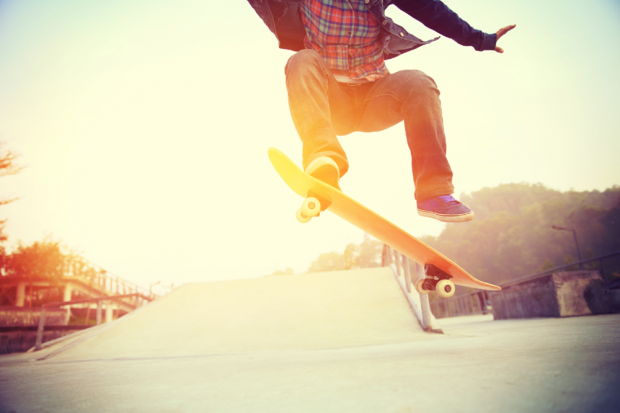 Teen Boy Doing A Skateboard Trick