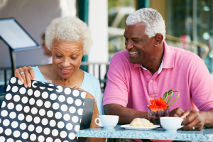 Elderly Couple Taking A Shopping Break