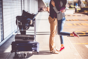 Couple Kissing At the Airport