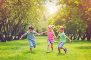 Children Running In the Grass