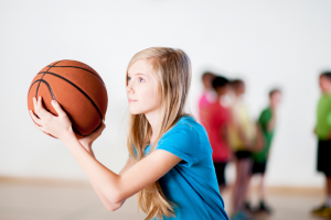 Young Girl Playing Basketball